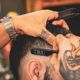 Devon Lane performs haircut using dangerous razor