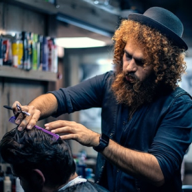 Ronald Richards showing his professionalism using scissors