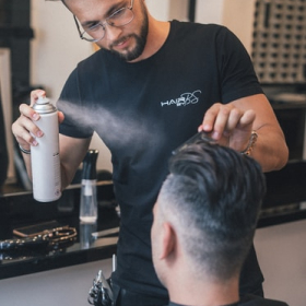 Devon Lane performs hair styling