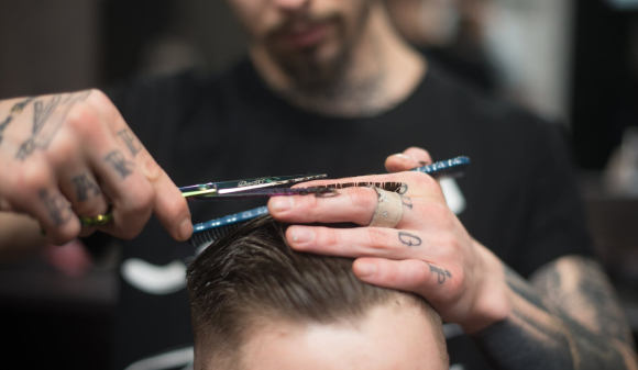Barber makes a classic haircut