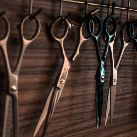 working scissors are hung on hooks
